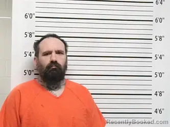 Mugshot of JUSTIN BYUS