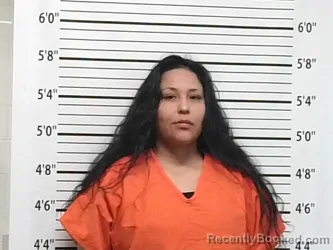 Mugshot of JENNY LYNN NESTELL booked in Caddo County, Oklahoma on April 9, 2026