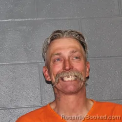 Mugshot of LARRY HANK CUSTARD booked in Canadian County, Oklahoma on May 13, 2026