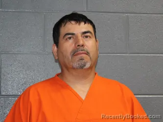 Mugshot of Cruz J Perez Flores booked in Canadian County, Oklahoma on July 27, 2026