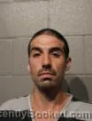 Mugshot of Carlos Miguel Tow booked in Cleveland County, Oklahoma on August 23, 2026