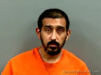 Mugshot of JUNIOR RICHARD PEREZ booked in Grady County, Oklahoma on May 21, 2026
