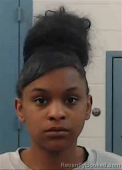 Mugshot of LESHE EXOM