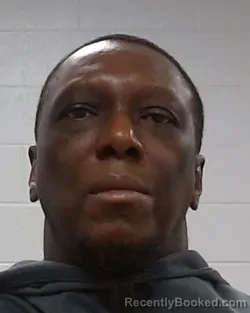 Mugshot of Adje Jean Mensah booked in Collin County, Texas on March 16, 2026