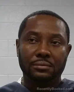 Mugshot of David Augustin booked in Collin County, Texas on March 22, 2026