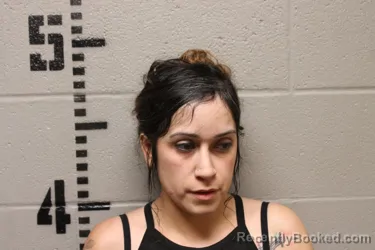 Mugshot of DOMINIQUE BURTON booked in Logan County, Oklahoma on June 22, 2026