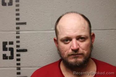 Mugshot of Joshua Woodrow Cronister booked in Logan County, Oklahoma on October 10, 2026