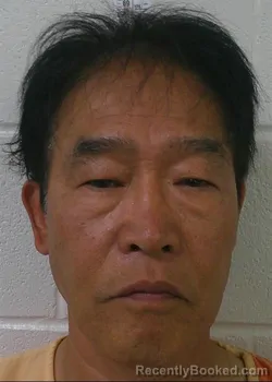 Mugshot of HUI SANG KIM booked in Love County, Oklahoma on May 18, 2026