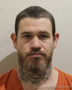 Mugshot of JUSTIN DWAYNE RILEY booked in McClain County, Oklahoma on March 24, 2026