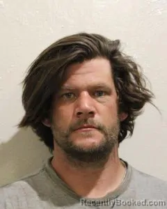 Mugshot of TRAVIS JOHN DOAIN JOHNSON booked in McClain County, Oklahoma on May 20, 2026