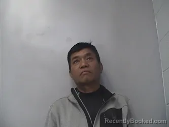 Mugshot of Lun Mang booked in Okmulgee County, Oklahoma on April 21, 2026