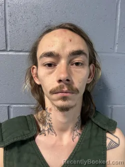 Mugshot of JUSTIN KOLE ROHMANN