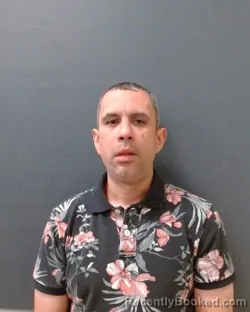 Mugshot of MITCHELL LEWIS HUGHES