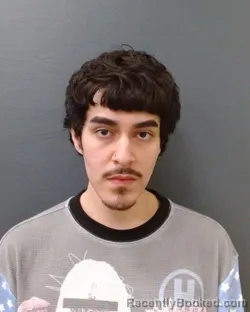 Mugshot of AVI JAMES COSIO booked in Comal County, Texas on April 11, 2026