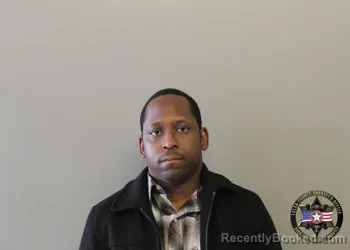 Mugshot of GLENN FIIFI COUSSEY GARBRAH booked in Tulsa County, Oklahoma on May 4, 2026