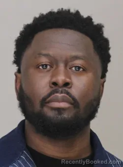 Mugshot of KUYPACEUENOC KOUEGBE booked in Dallas County, Texas on March 29, 2026