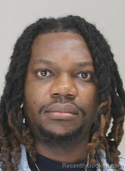 Mugshot of AKINWALE OLAWAIYE booked in Dallas County, Texas on April 1, 2026