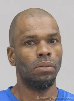 Mugshot of COREY HOLMES booked in Dallas County, Texas on April 8, 2026