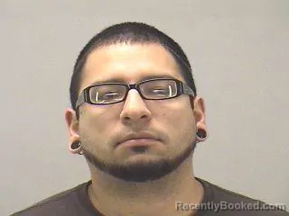 Mugshot of ADRIAN REYNOSO booked in Dallas County, Texas on April 11, 2026