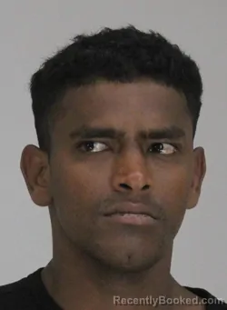 Mugshot of RANZAN ALI booked in Dallas County, Texas on April 12, 2026