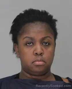 Mugshot of ISABELLA GATHONI booked in Dallas County, Texas on April 13, 2026