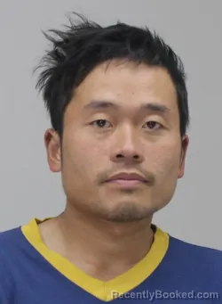 Mugshot of LONG LE booked in Dallas County, Texas on April 13, 2026