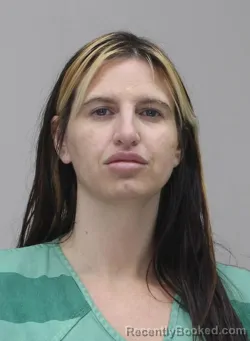 Mugshot of AMBER WELLS booked in Dallas County, Texas on April 14, 2026