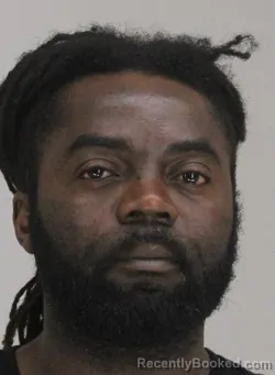 Mugshot of JUSTIN NGUESSAN booked in Dallas County, Texas on April 19, 2026