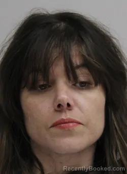 Mugshot of MEGAN FARHAT booked in Dallas County, Texas on May 13, 2026