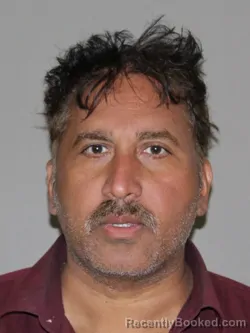 Mugshot of Sibi M Mathew booked in Denton County, Texas on June 12, 2026