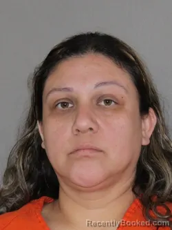 Mugshot of Yuliana Mendoza booked in Denton County, Texas on March 14, 2026