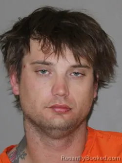 Mugshot of George Atchison booked in Denton County, Texas on April 10, 2026