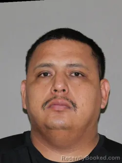 Mugshot of Juan A Bustos Bonami booked in Denton County, Texas on May 18, 2026