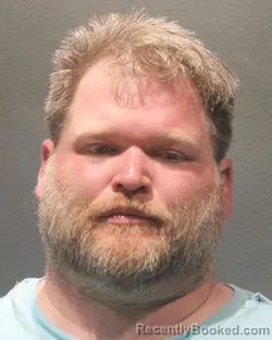 Mugshot of DANA ANDREW SOUTHARD MOORE booked in Arlington County, Virginia on April 15, 2026