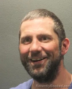 Mugshot of ROBERT DOUGLAS GUY booked in Arlington County, Virginia on April 22, 2026