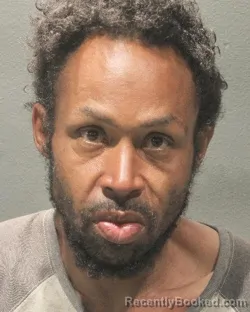 Mugshot of JUSTIN DENARD STEWART booked in Arlington County, Virginia on April 22, 2026