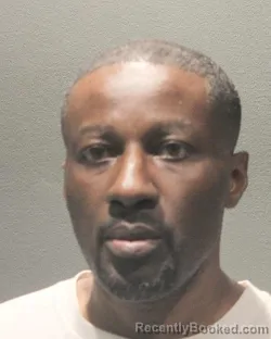 Mugshot of BABATUNDE OLUWASEUN ADEKSON booked in Arlington County, Virginia on May 6, 2026