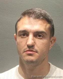 Mugshot of IZZET BURAK TEMEL booked in Arlington County, Virginia on May 13, 2026