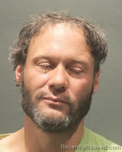 Mugshot of BRANDON TERRY ROZELL booked in Arlington County, Virginia on May 13, 2026