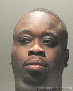Mugshot of KAYODE OLAMIDOTUN Third TOMIYE booked in Arlington County, Virginia on May 25, 2026