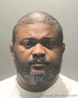 Mugshot of OLUFUNMILADE AMUSAN booked in Arlington County, Virginia on June 18, 2026