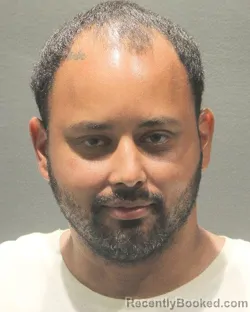 Mugshot of REY ESTEBAN RAMOS-ORTIZ booked in Arlington County, Virginia on June 24, 2026