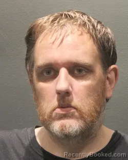 Mugshot of ADAM WAYNE GAUTIER booked in Arlington County, Virginia on July 7, 2026