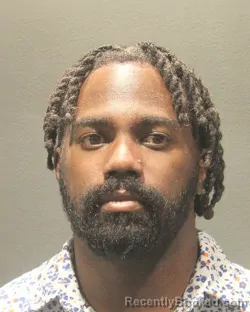 Mugshot of TRAVIS ANTONIO HIGHLAND booked in Arlington County, Virginia on August 4, 2026