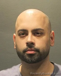 Mugshot of Aryan Zahergivar booked in Arlington County, Virginia on August 24, 2026