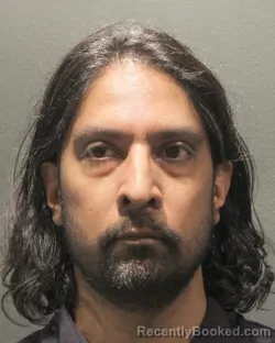 Mugshot of Aneil Adrian Ramdeo booked in Arlington County, Virginia on August 28, 2026