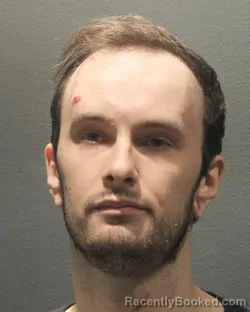 Mugshot of Logan Charles Nitchie booked in Arlington County, Virginia on August 30, 2026