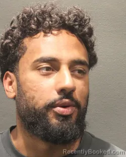 Mugshot of Mahendra Christopher Dudar booked in Arlington County, Virginia on August 31, 2026