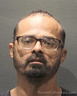 Mugshot of Delfino Alexander Ramirez booked in Arlington County, Virginia on August 31, 2026