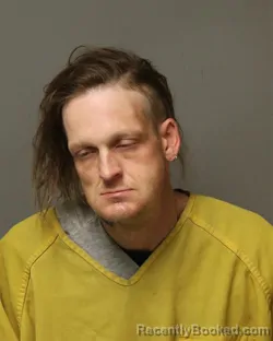 Mugshot of JUSTIN MICHAEL THOMPSON